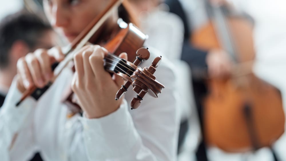 talented-violinist-playing-with-orchestra-2021-08-26-22-39-56-utc